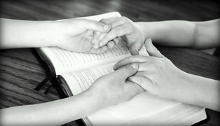 prayer holding hands